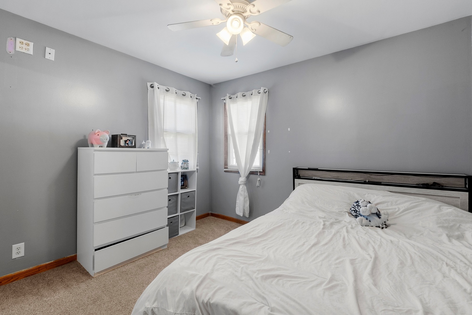 808 Stonegate Road New Lenox, IL 60451 - Photo 13 of 24 a bedroom with a bed and a chandelier