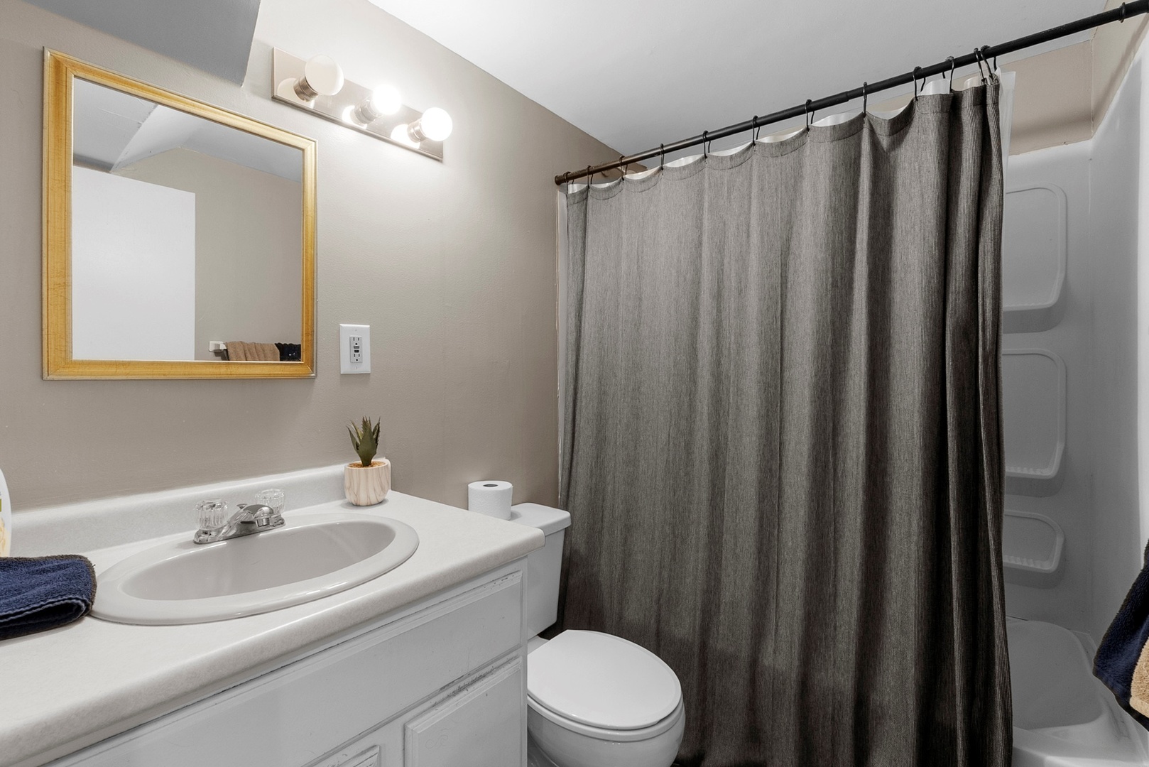 808 Stonegate Road New Lenox, IL 60451 - Photo 14 of 24 a bathroom with a sink a toilet a mirror and shower curtain