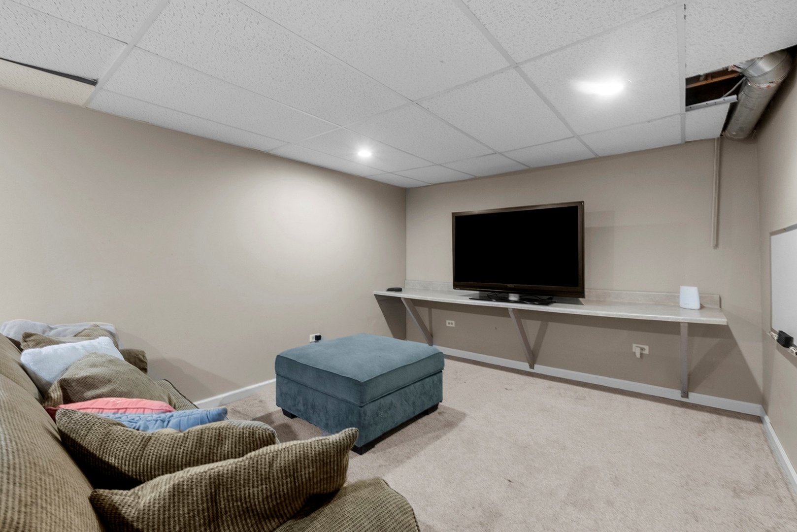 808 Stonegate Road New Lenox, IL 60451 - Photo 16 of 24 a living room with furniture and a flat screen tv