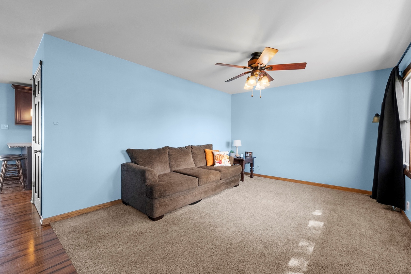 808 Stonegate Road New Lenox, IL 60451 - Photo 2 of 24 a living room with furniture and a ceiling fan