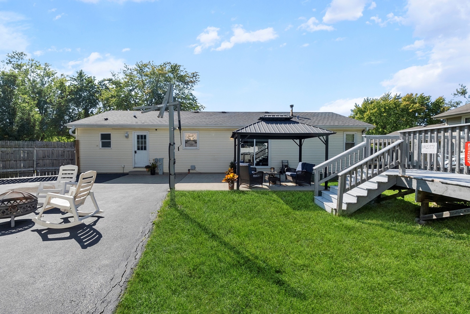 808 Stonegate Road New Lenox, IL 60451 - Photo 23 of 24 a view of a patio with a table and chairs