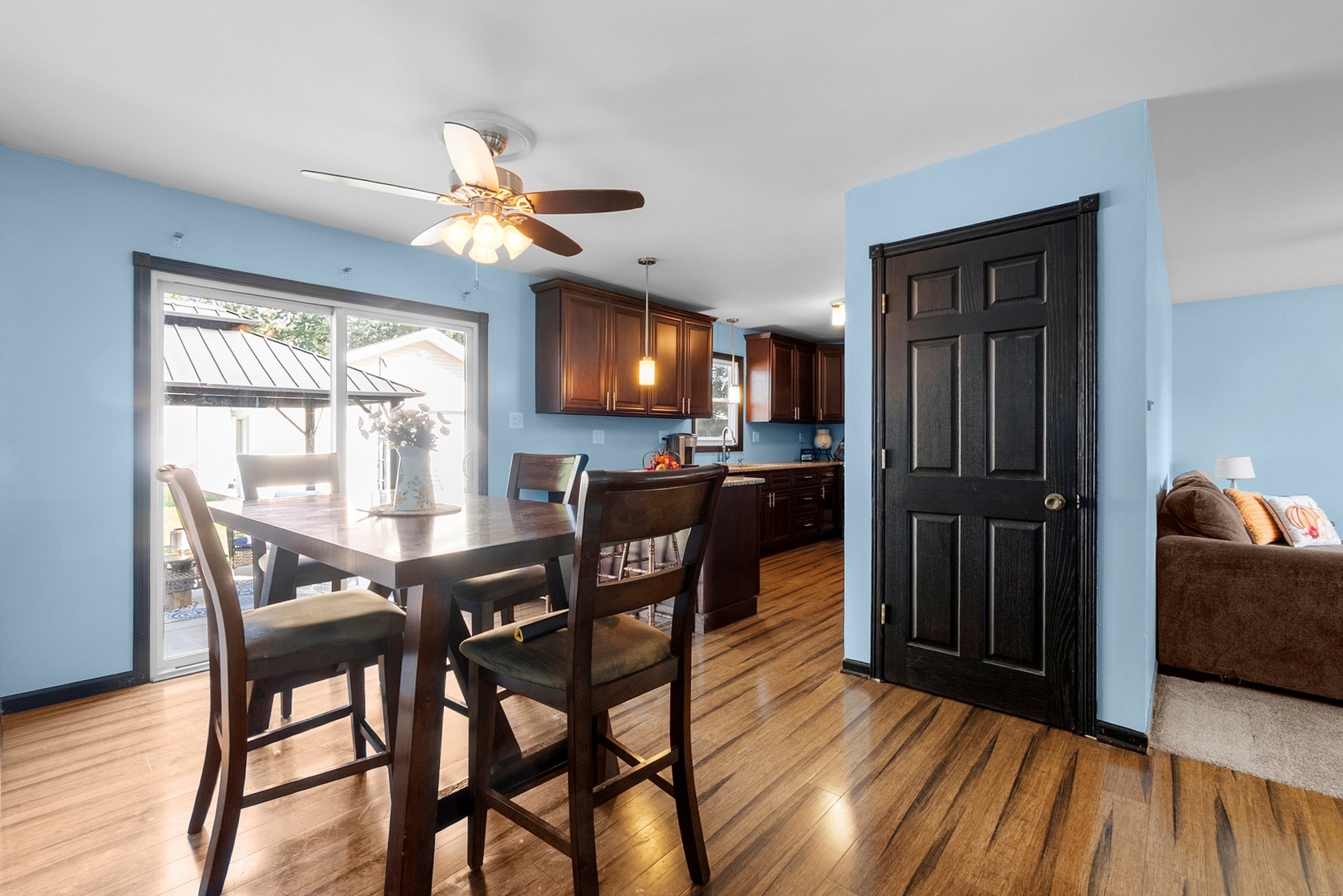 808 Stonegate Road New Lenox, IL 60451 - Photo 4 of 24 a view of a dining room with furniture window and wooden floor