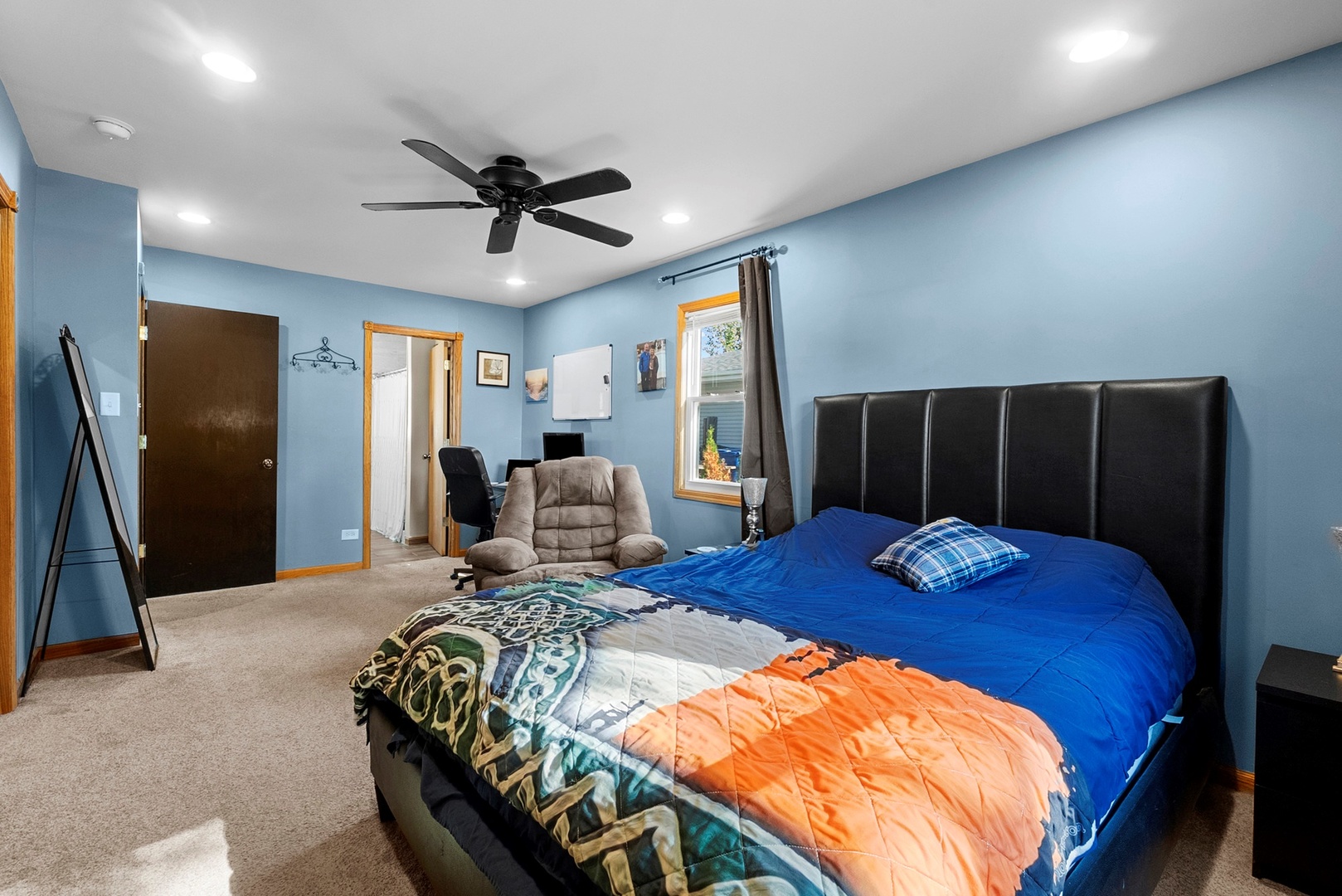 808 Stonegate Road New Lenox, IL 60451 - Photo 8 of 24 a bedroom with a bed and a walk in closet