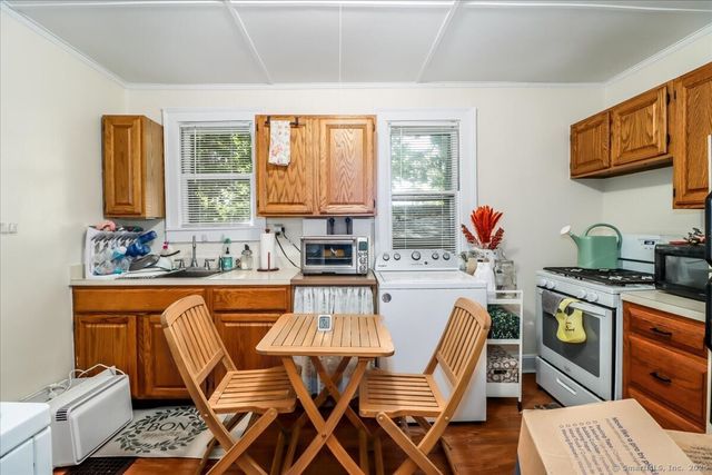 a very nice looking kitchen with a large window