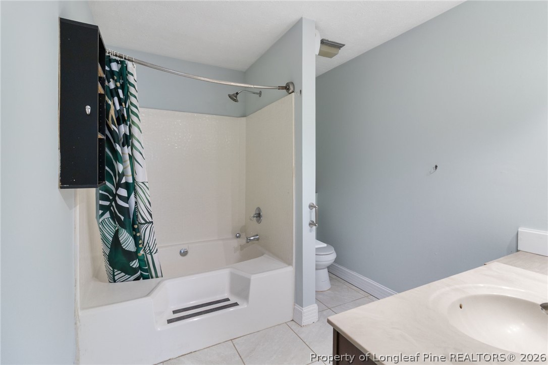 1908 Tryon Drive, Unit 1 Fayetteville, NC 28303 - Photo 17 of 29 a bathroom with a bathtub and shower