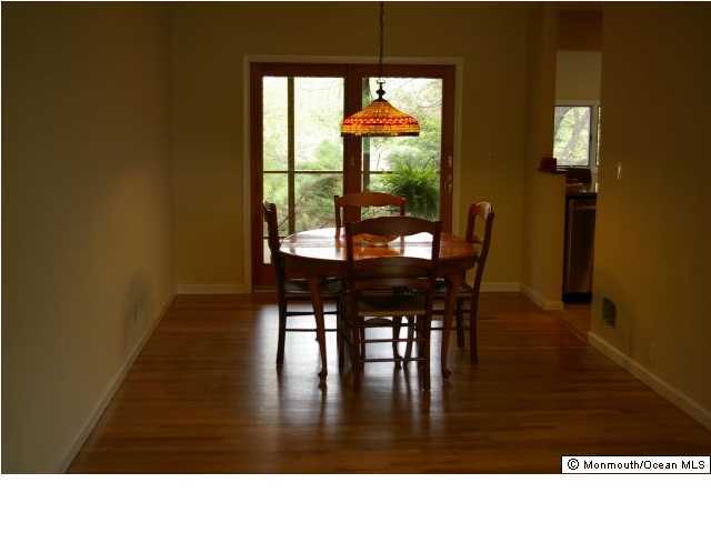 24 Chestnut Ridge Road Holmdel, NJ 07733 - Photo 3 of 3 a black and white photo of a living room