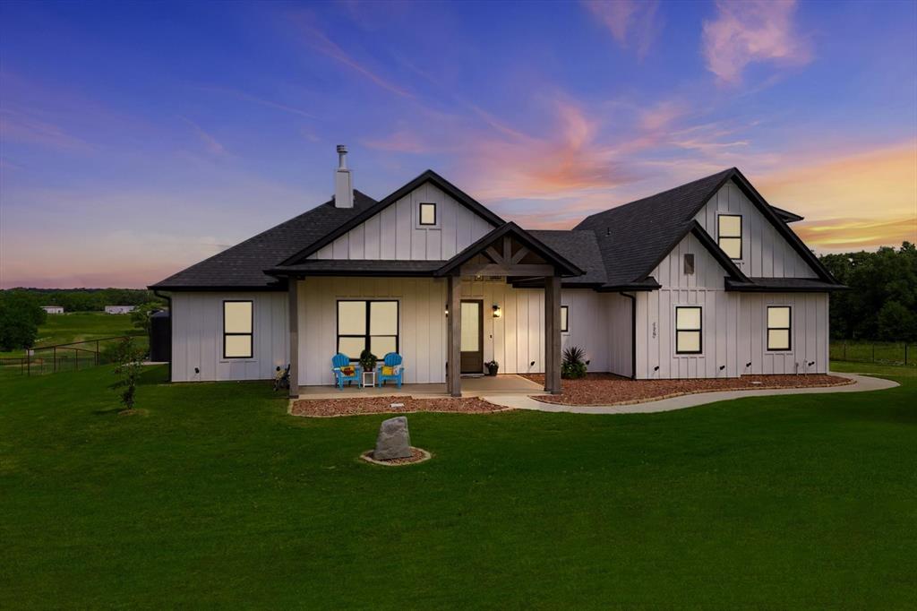 120 Grace Vw Road Weatherford, TX 76088 - Photo 2 of 40 Modern farmhouse exterior featuring white board and batten siding, dark trim, and a black shingle roof