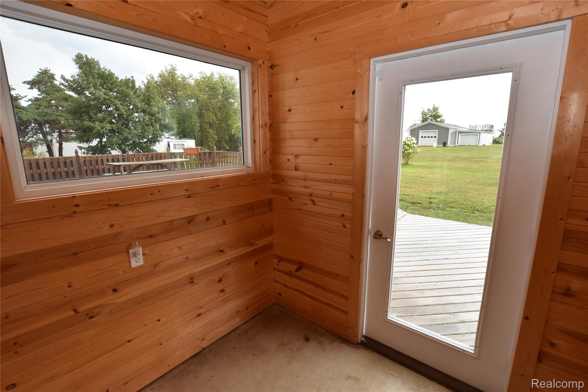 7736 Sanilac Road Kingston, MI 48741 - Photo 18 of 31 Knotty pine mudroom