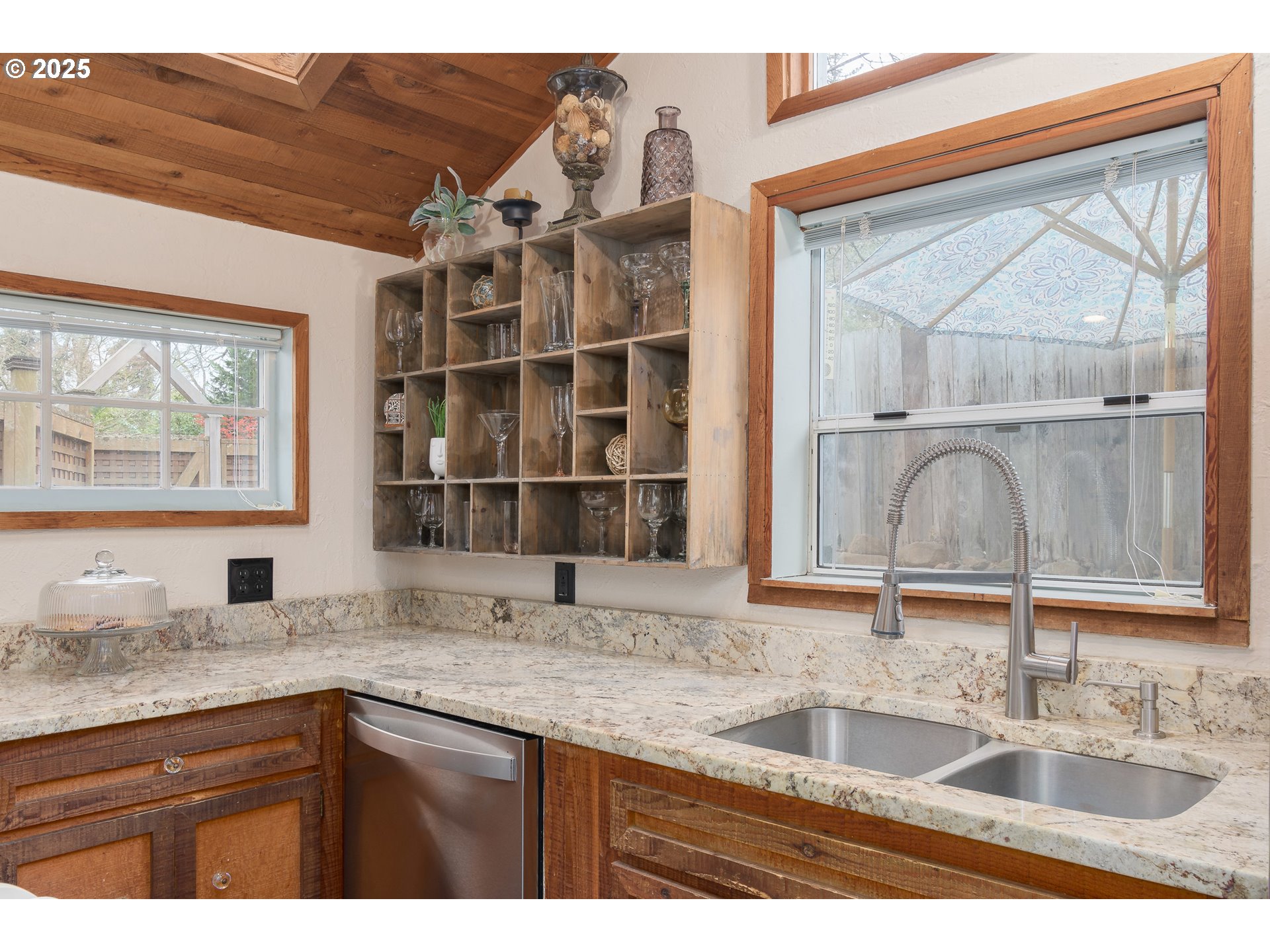 25 West 36th Avenue Eugene, OR 97405 - Photo 12 of 33 a kitchen with granite countertop a sink and a window