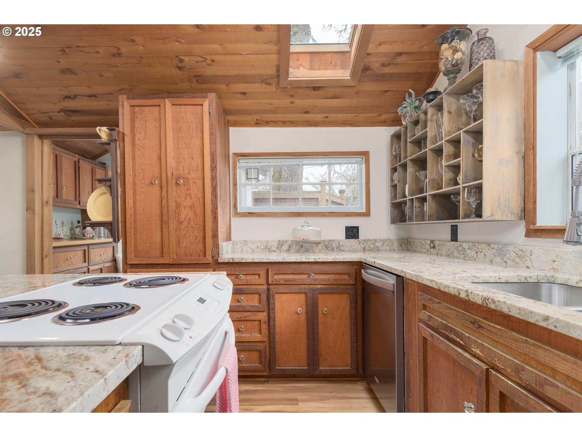 25 West 36th Avenue Eugene, OR 97405 - Photo 13 of 33 a kitchen that has a sink and a stove