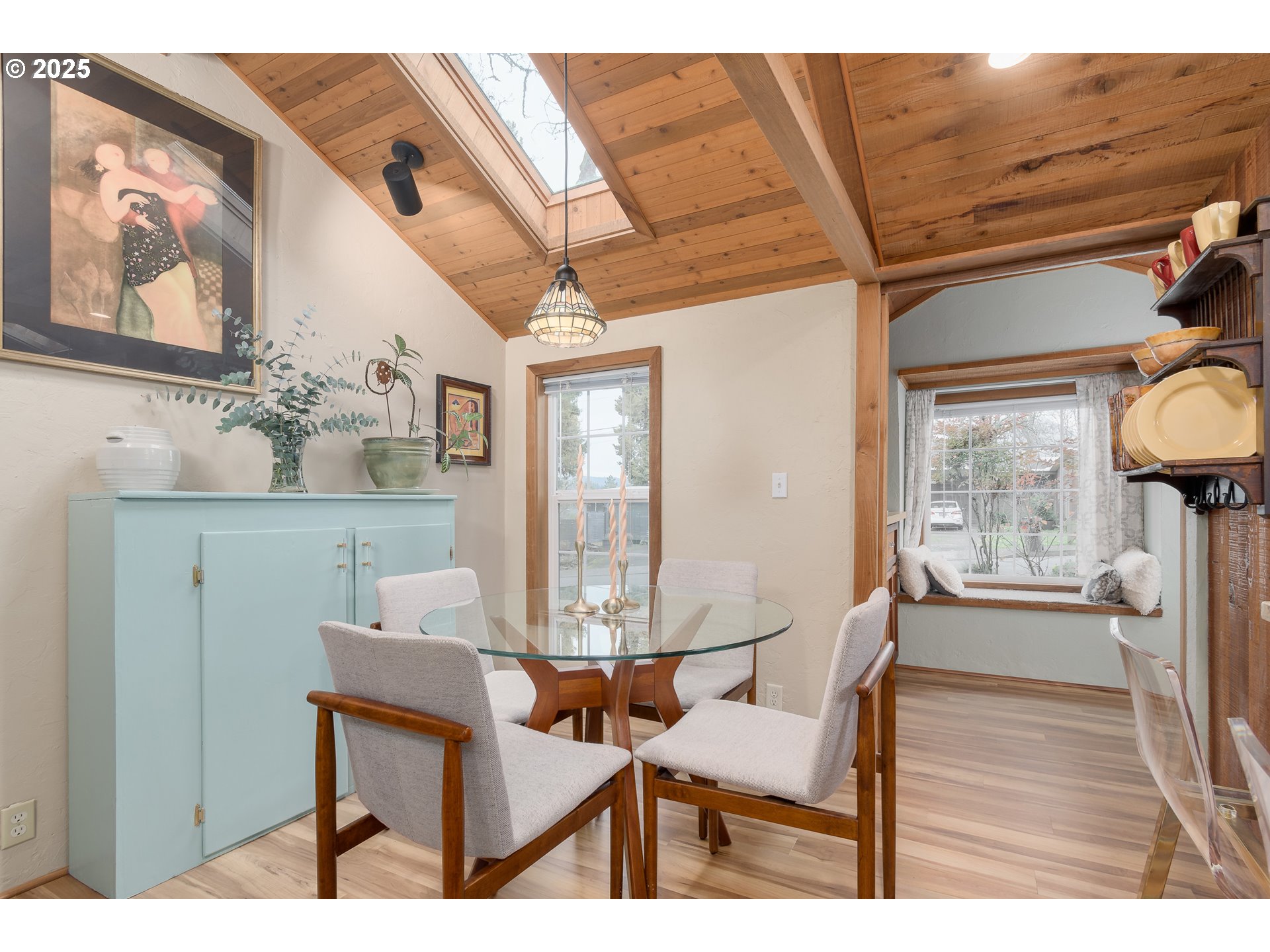 25 West 36th Avenue Eugene, OR 97405 - Photo 15 of 33 a view of a dining room with furniture a chandelier and wooden floor
