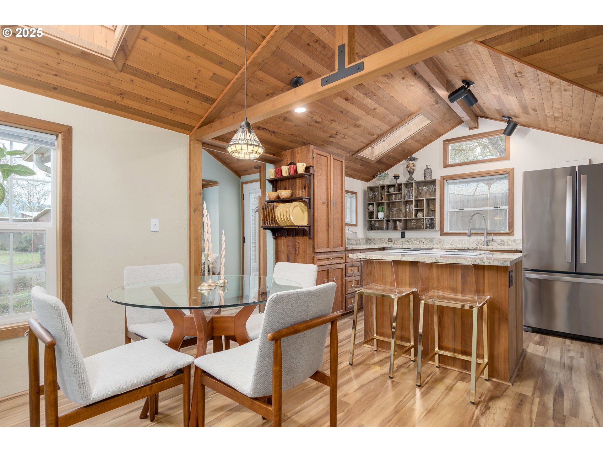 25 West 36th Avenue Eugene, OR 97405 - Photo 16 of 33 a dining room with furniture and wooden floor