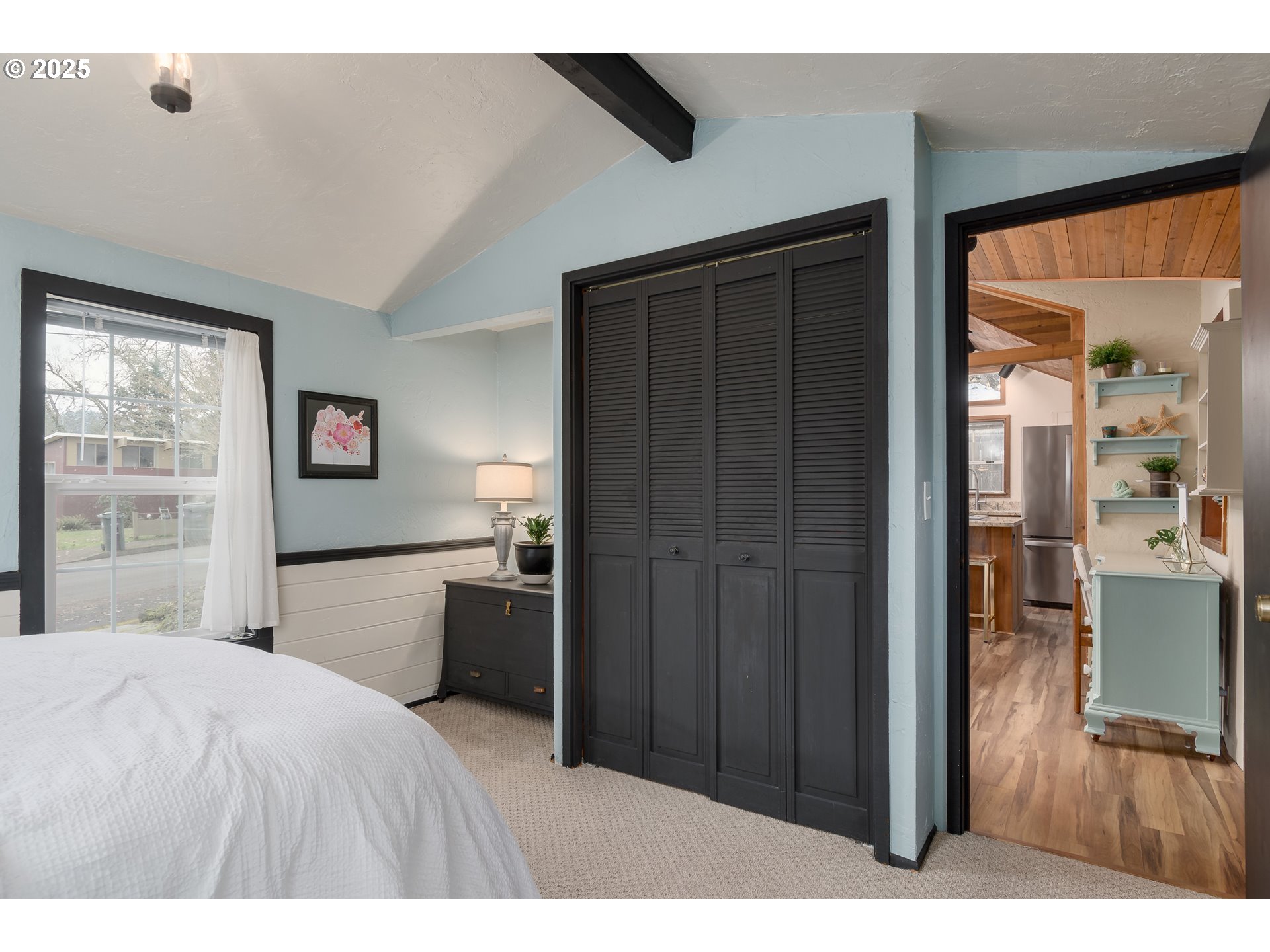 25 West 36th Avenue Eugene, OR 97405 - Photo 20 of 33 a bedroom with a bed and a large window