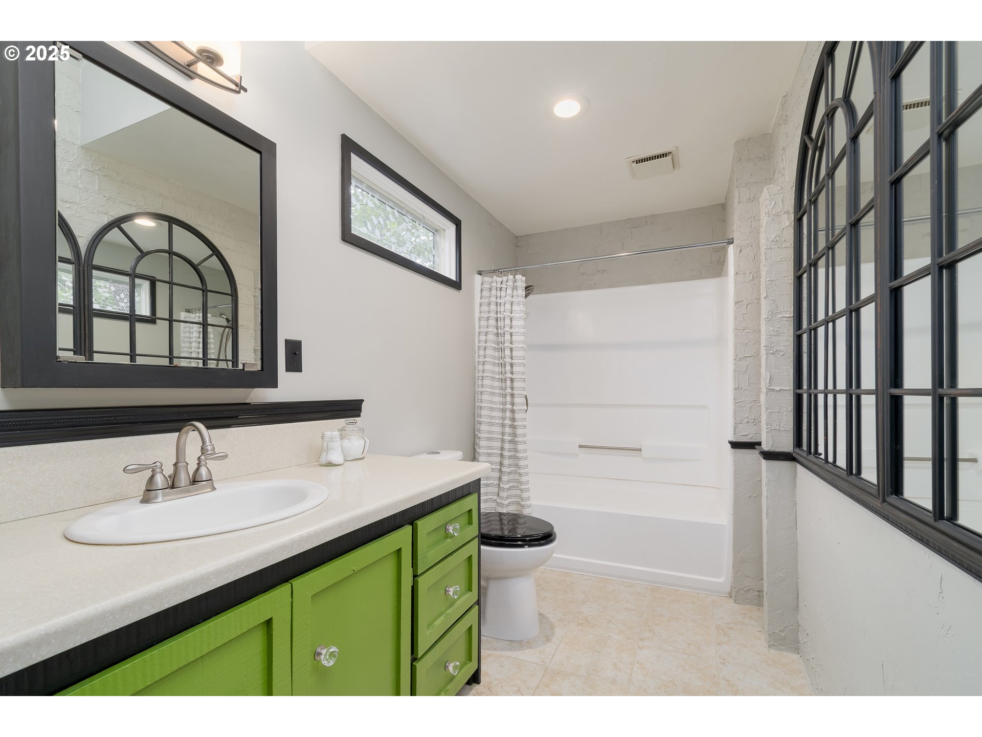 25 West 36th Avenue Eugene, OR 97405 - Photo 23 of 33 a bathroom with a sink double vanity and a shower