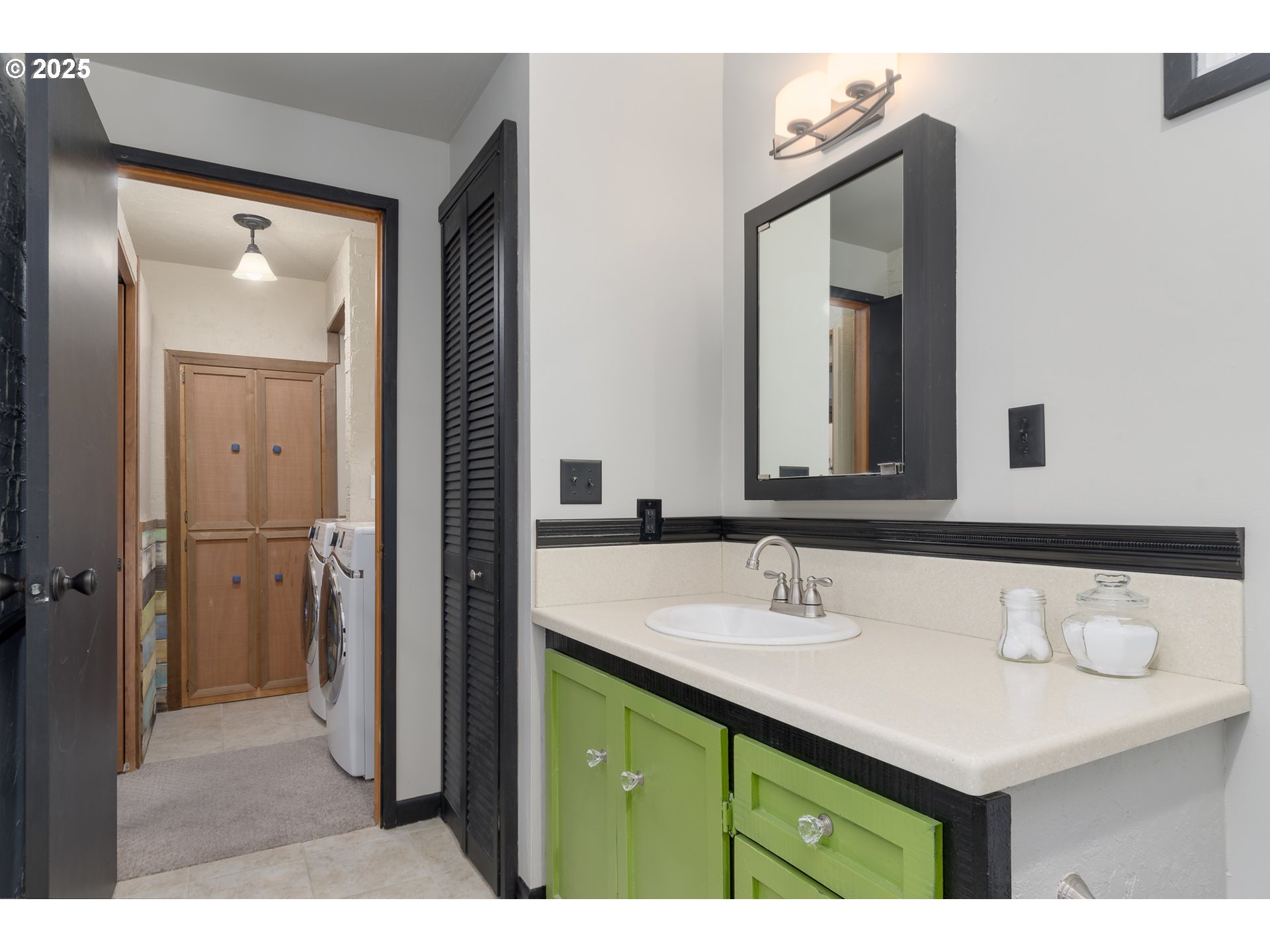 25 West 36th Avenue Eugene, OR 97405 - Photo 24 of 33 a bathroom with a sink vanity and a mirror