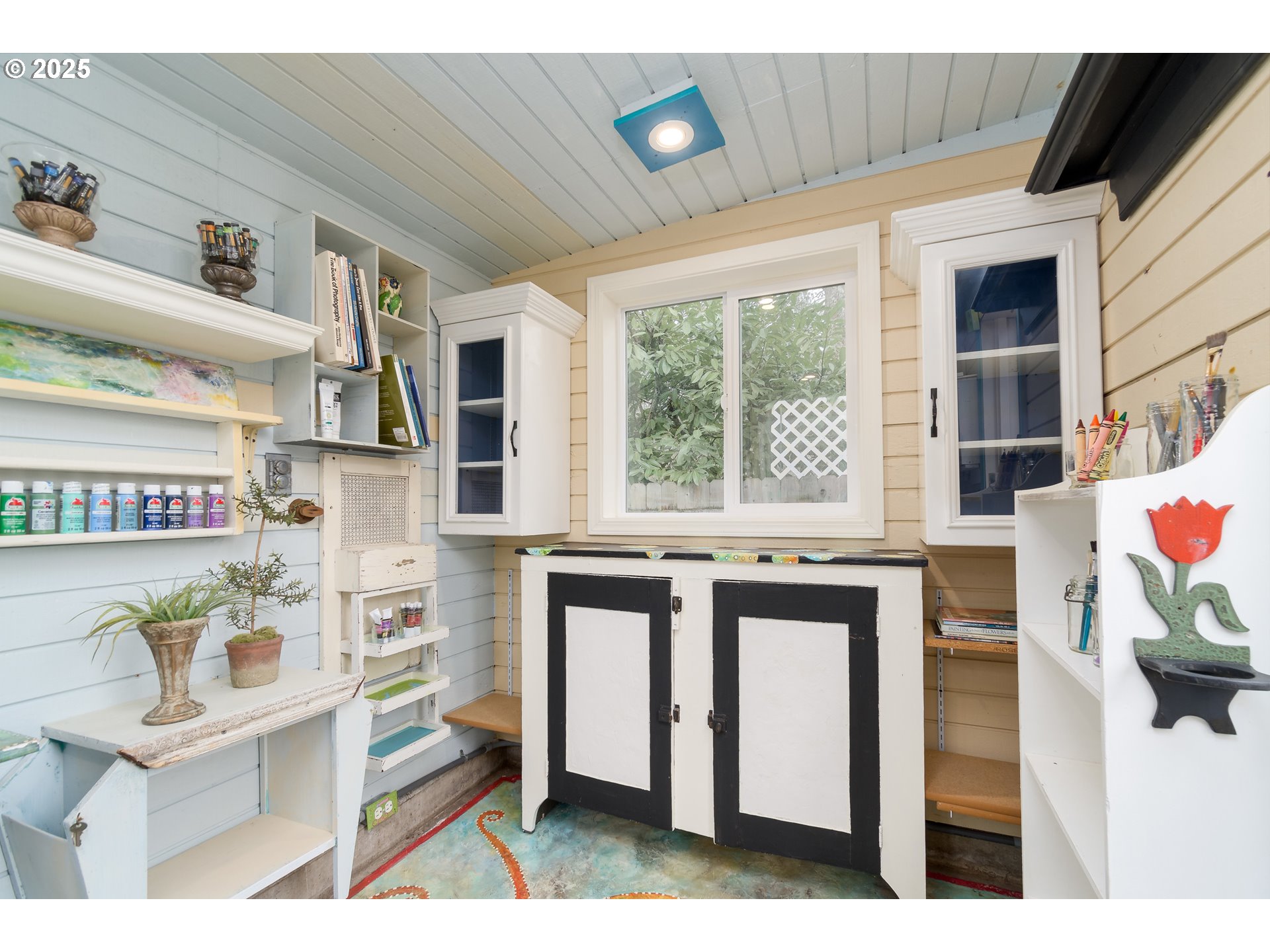 25 West 36th Avenue Eugene, OR 97405 - Photo 29 of 33 a kitchen with stainless steel appliances kitchen island granite countertop a stove a sink and a microwave