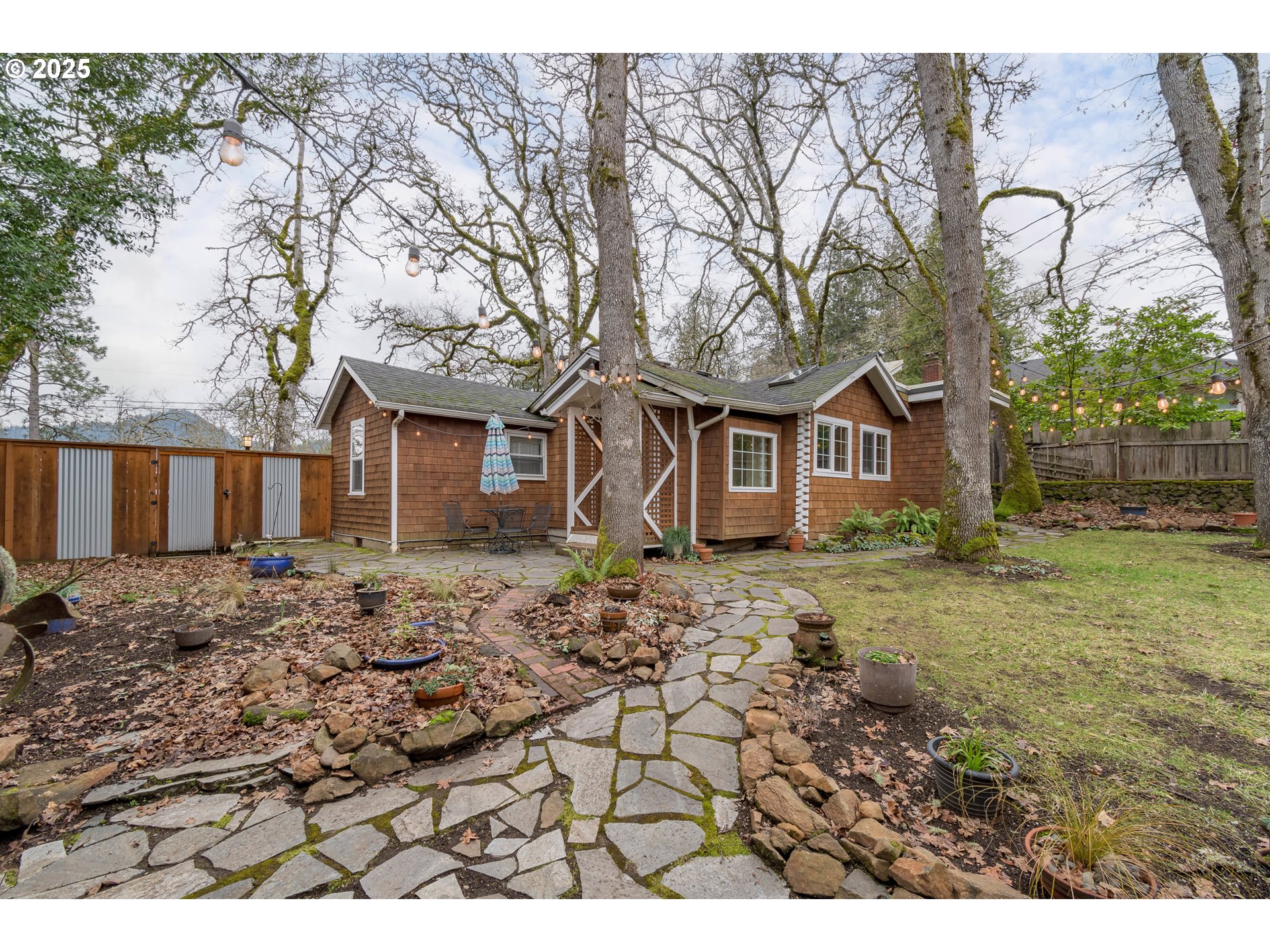 25 West 36th Avenue Eugene, OR 97405 - Photo 30 of 33 a front view of a house with a yard