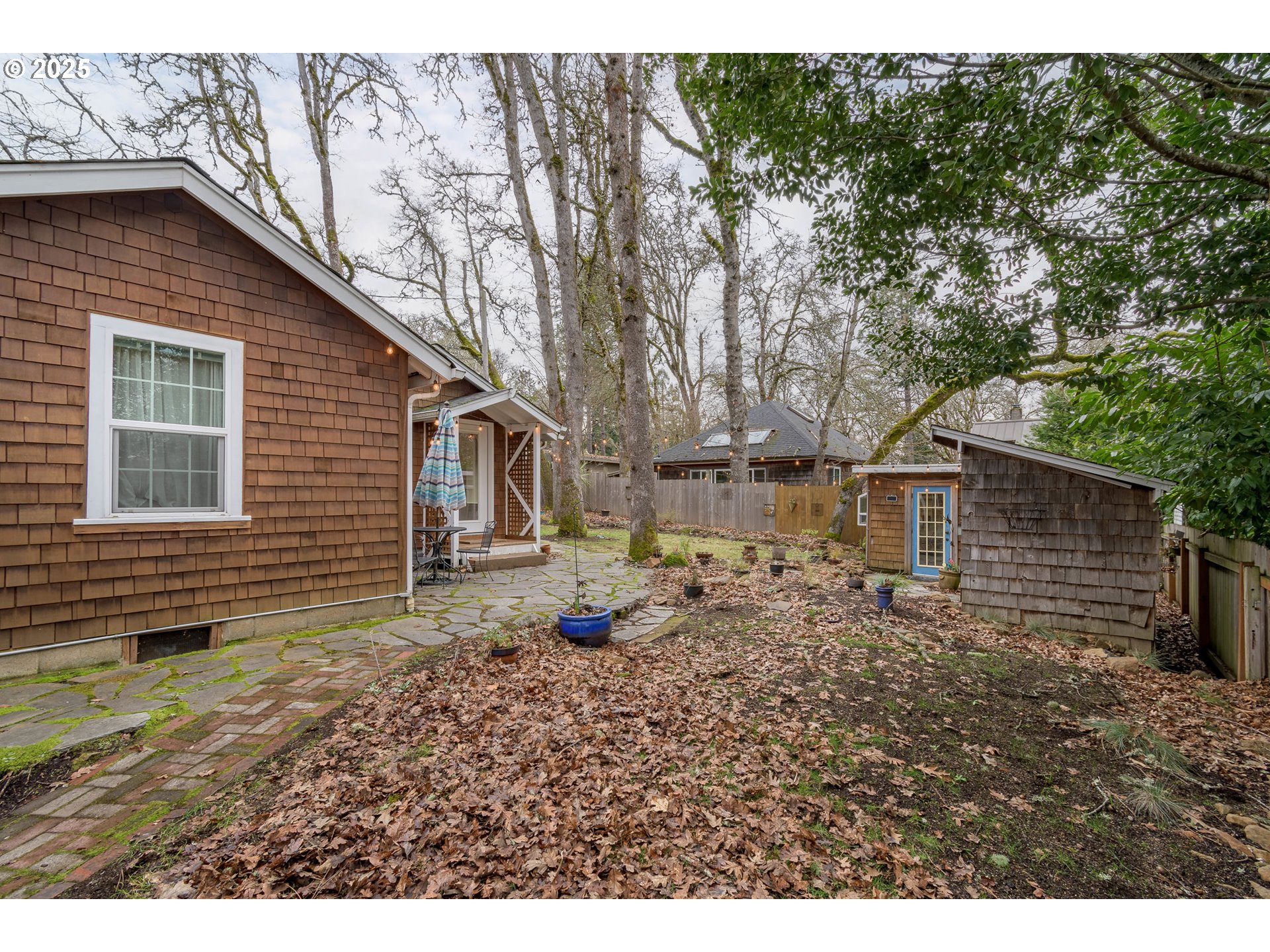 25 West 36th Avenue Eugene, OR 97405 - Photo 3 of 33 a backyard of a house with barbeque oven