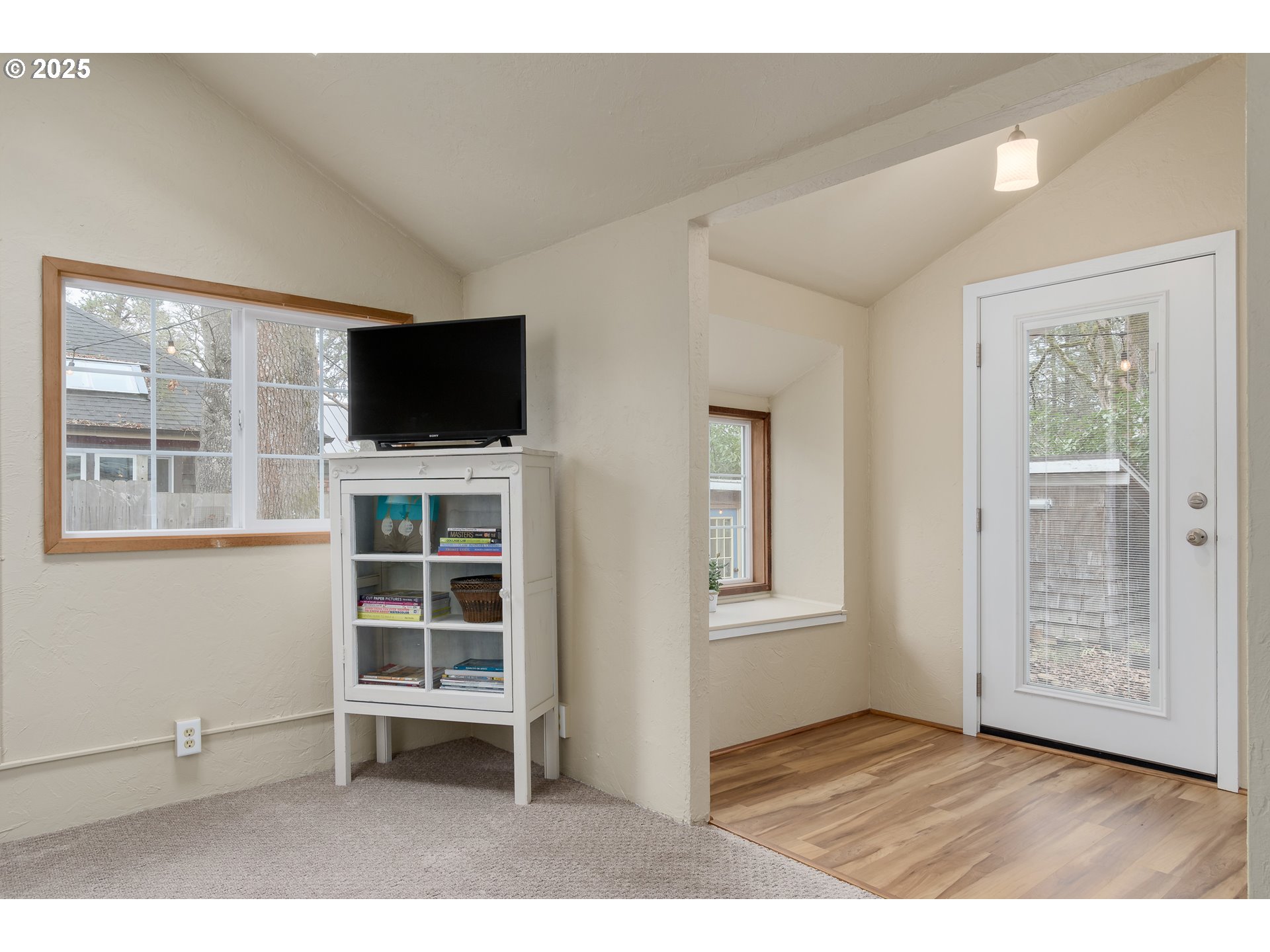25 West 36th Avenue Eugene, OR 97405 - Photo 8 of 33 a view of an empty room with a window and wooden floor