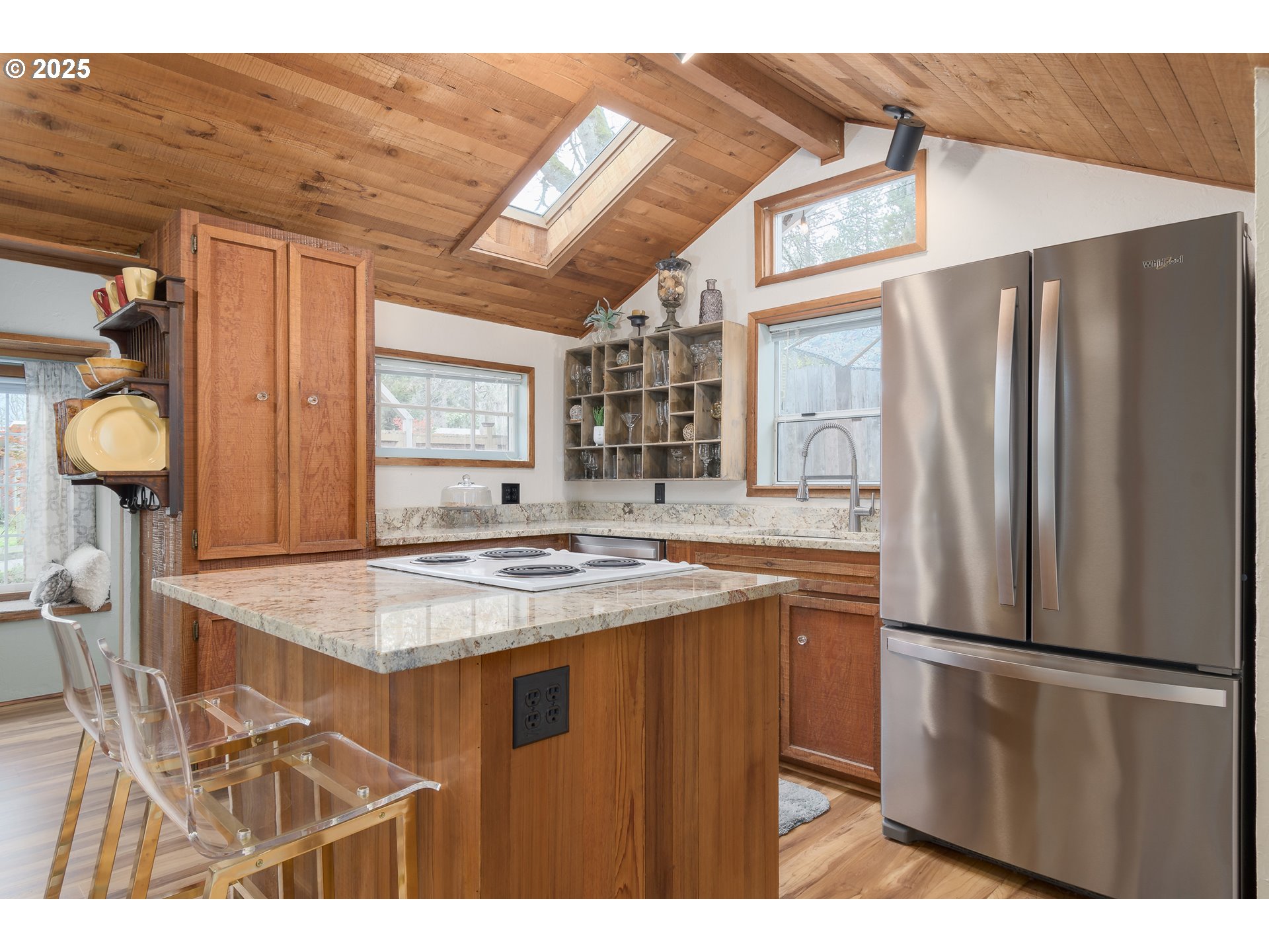 25 West 36th Avenue Eugene, OR 97405 - Photo 10 of 33 a kitchen with stainless steel appliances granite countertop a refrigerator and a stove