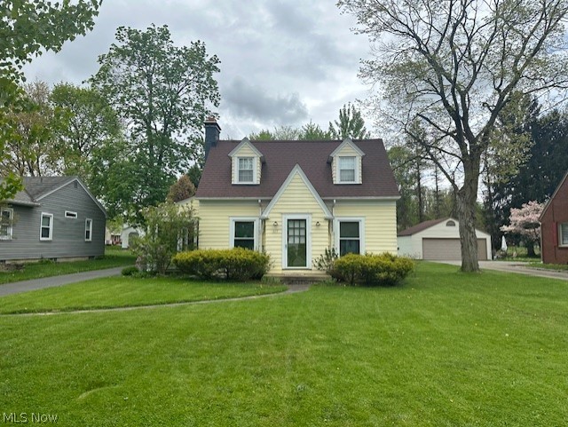 317 Ewing Road Youngstown, OH 44512 - Photo 15 of 15 New england style home featuring an outdoor structure, a garage, and a front yard