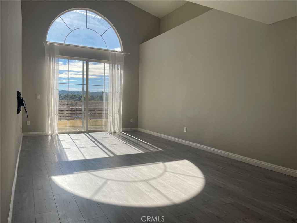 6800 Corbin Avenue Reseda, CA 91335 - Photo 33 of 37 a view of empty room with wooden floor and fan