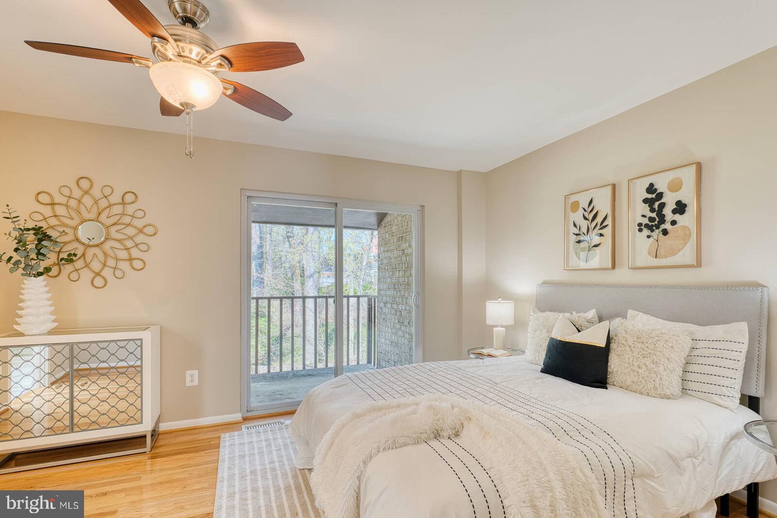 9238 Three Oaks Drive Silver Spring, MD 20901 - Photo 17 of 42 a bedroom with a large bed and a window