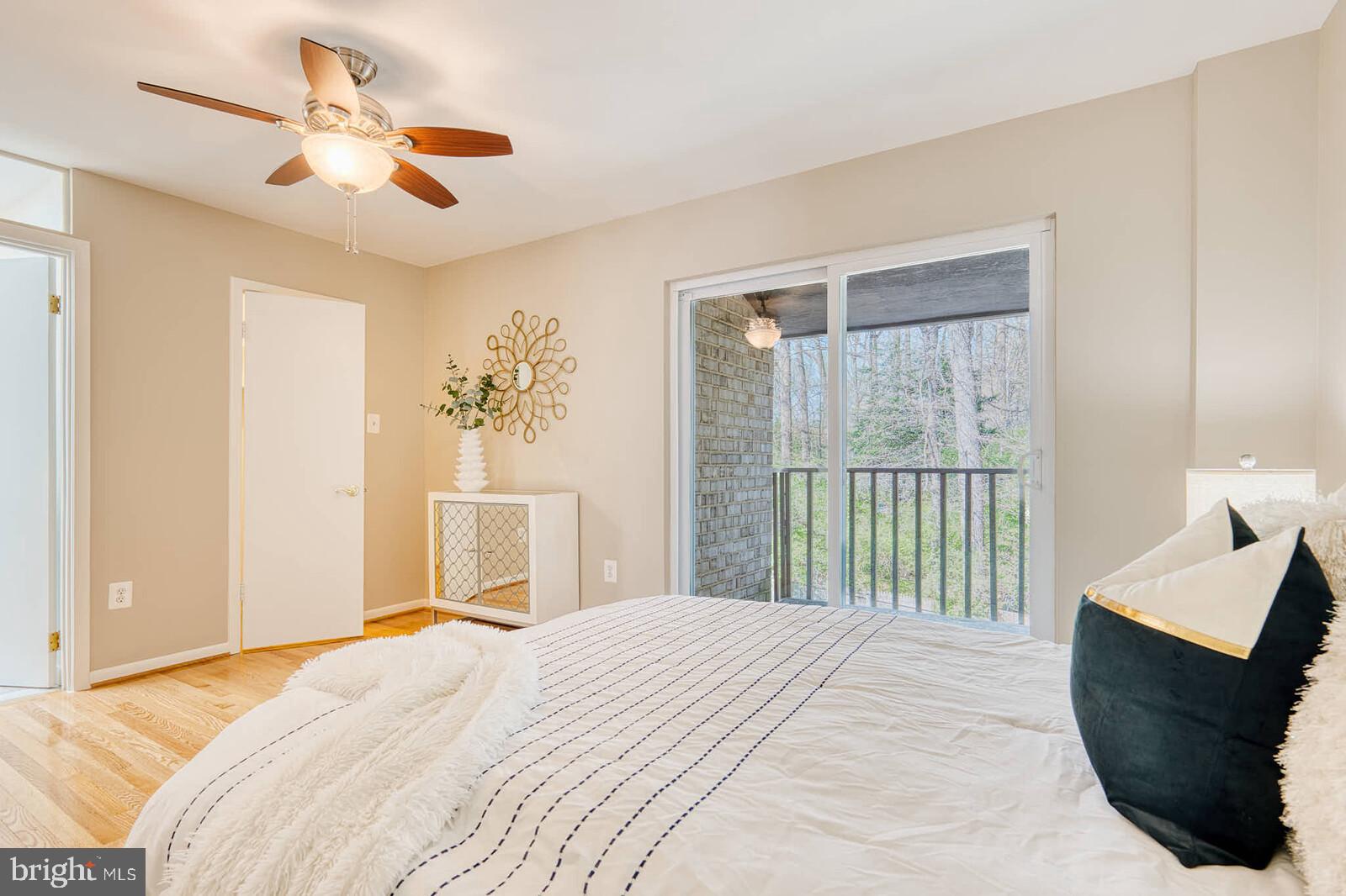 9238 Three Oaks Drive Silver Spring, MD 20901 - Photo 18 of 42 a bedroom with a large bed and a window