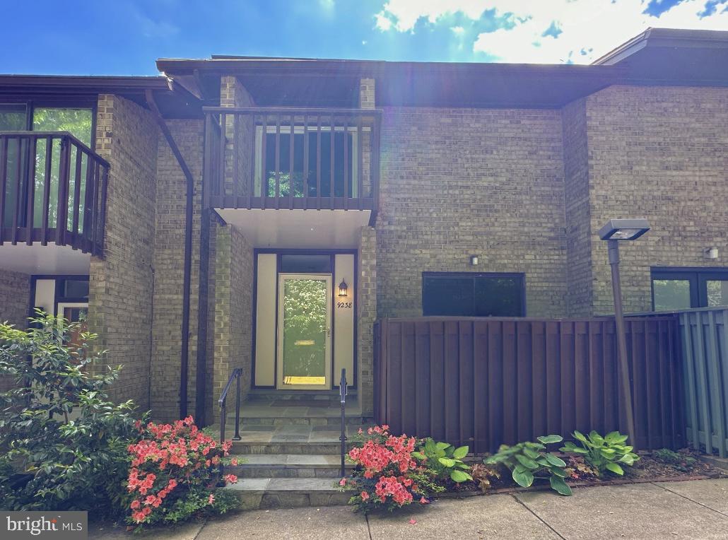 9238 Three Oaks Drive Silver Spring, MD 20901 - Photo 2 of 42 a front view of a house with a garden