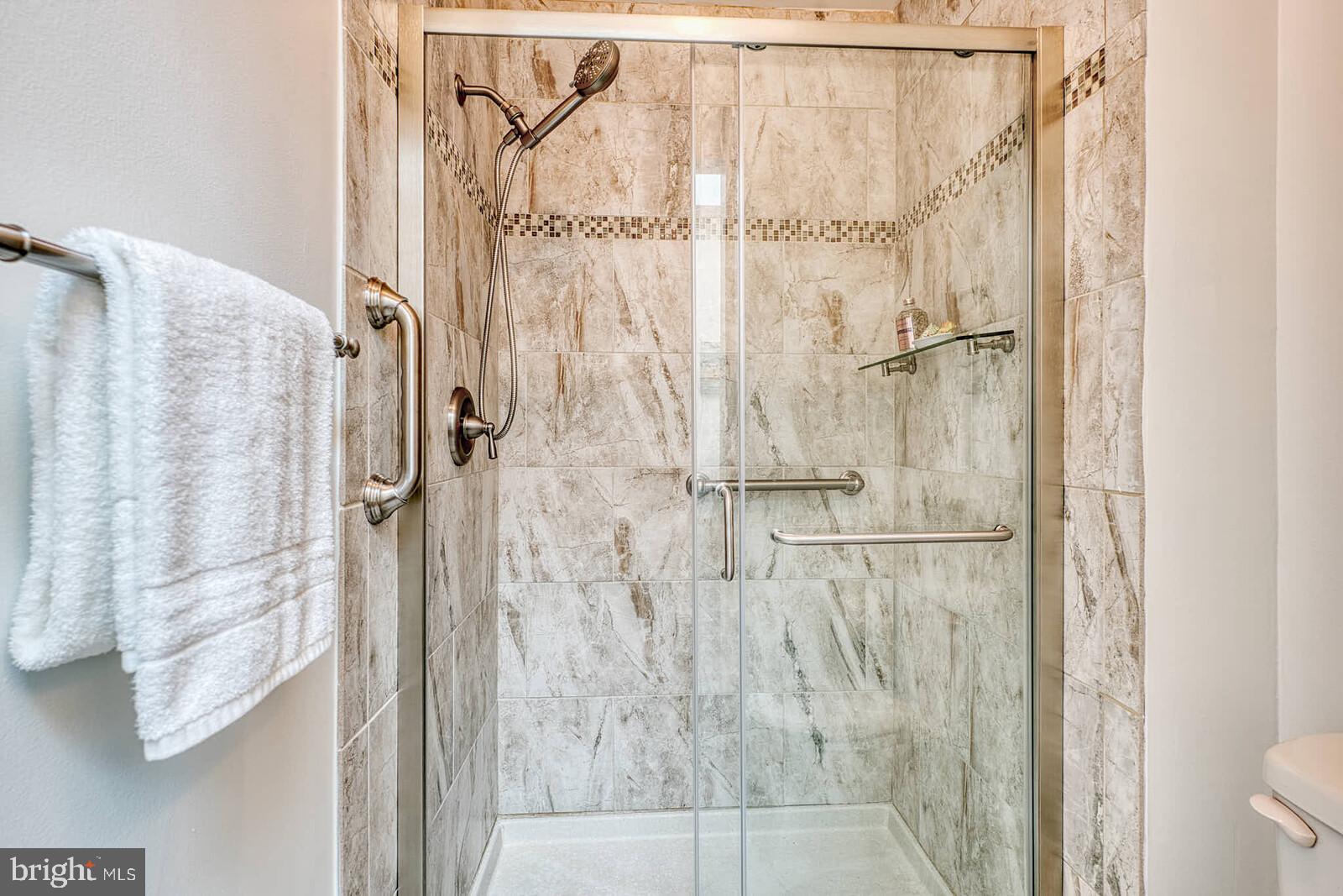 9238 Three Oaks Drive Silver Spring, MD 20901 - Photo 21 of 42 a bathroom with a shower