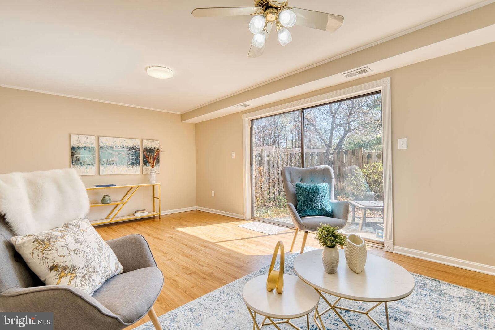 9238 Three Oaks Drive Silver Spring, MD 20901 - Photo 35 of 42 a living room with furniture and a window