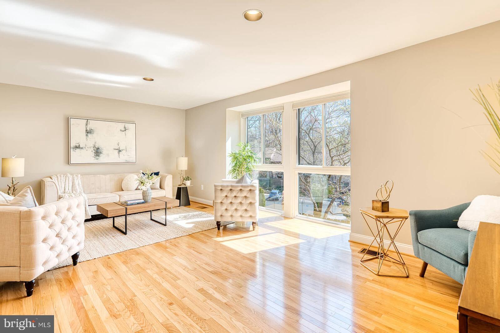 9238 Three Oaks Drive Silver Spring, MD 20901 - Photo 5 of 42 a living room with furniture and a large window