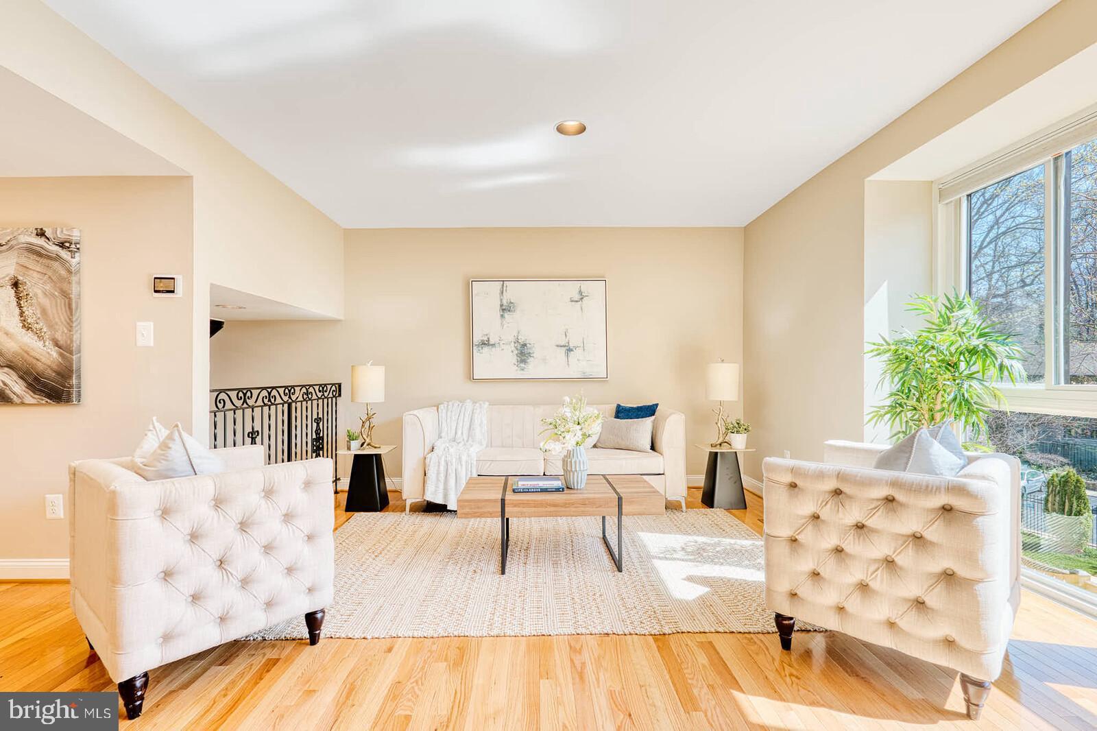 9238 Three Oaks Drive Silver Spring, MD 20901 - Photo 6 of 42 a living room with furniture and wooden floor