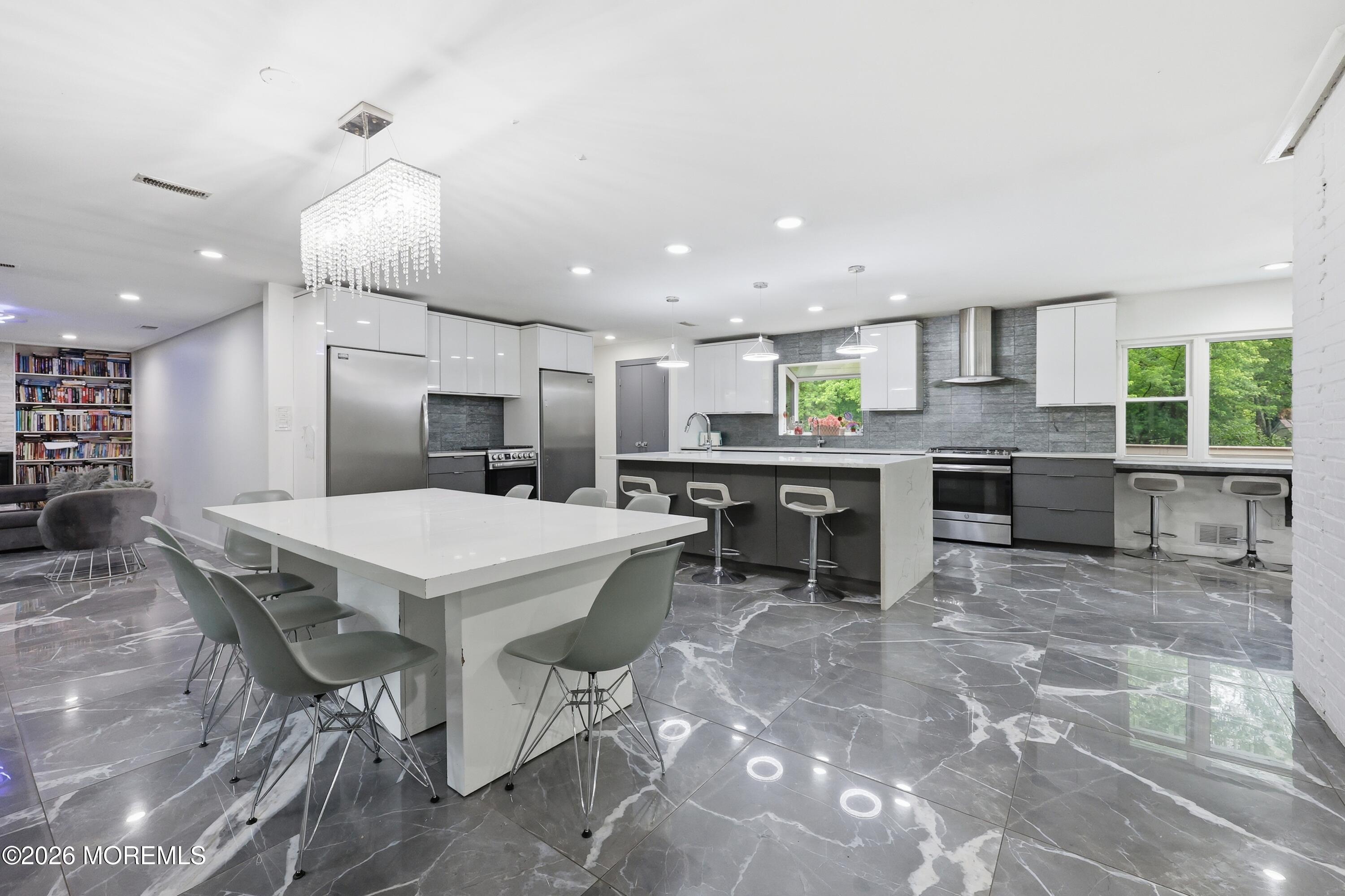 1845 Old Freehold Road Toms River, NJ 08755 - Photo 1 of 27 a large kitchen with a table and chairs in it