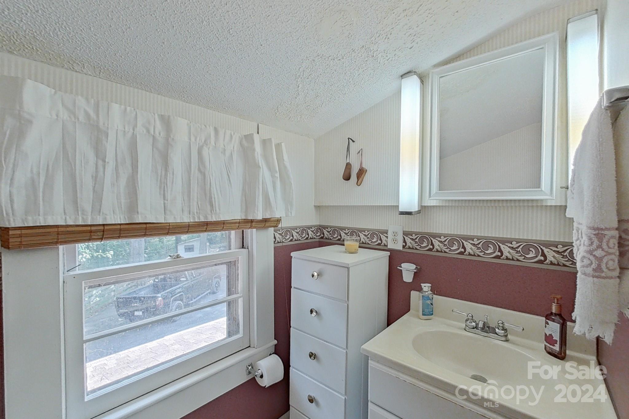613 Dellinger Road Shelby, NC 28152 - Photo 12 of 19 a bathroom with a granite countertop sink a toilet and bathtub