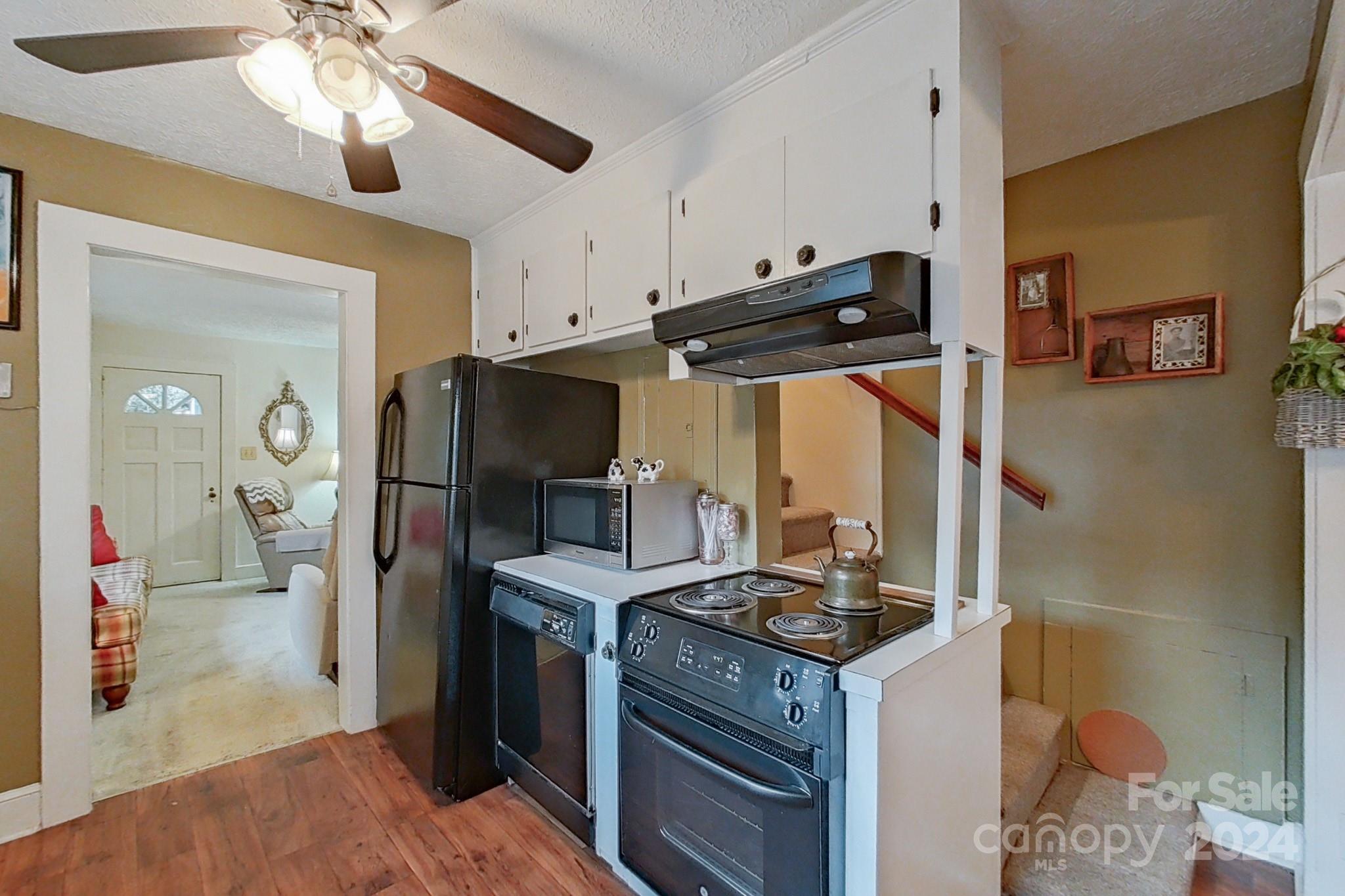 613 Dellinger Road Shelby, NC 28152 - Photo 5 of 19 a kitchen with stainless steel appliances granite countertop a stove and a refrigerator