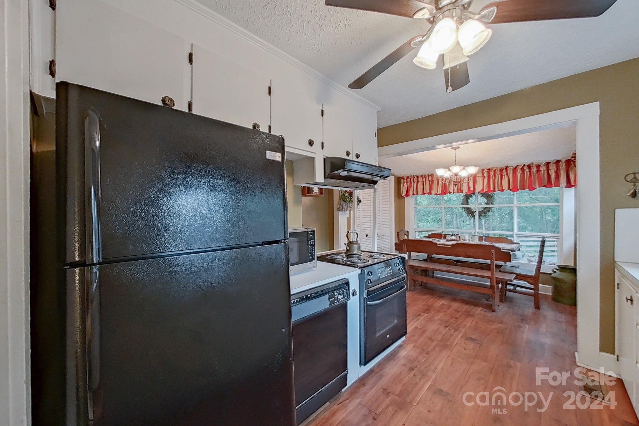 613 Dellinger Road Shelby, NC 28152 - Photo 6 of 19 a kitchen with stainless steel appliances granite countertop a refrigerator a sink and a stove