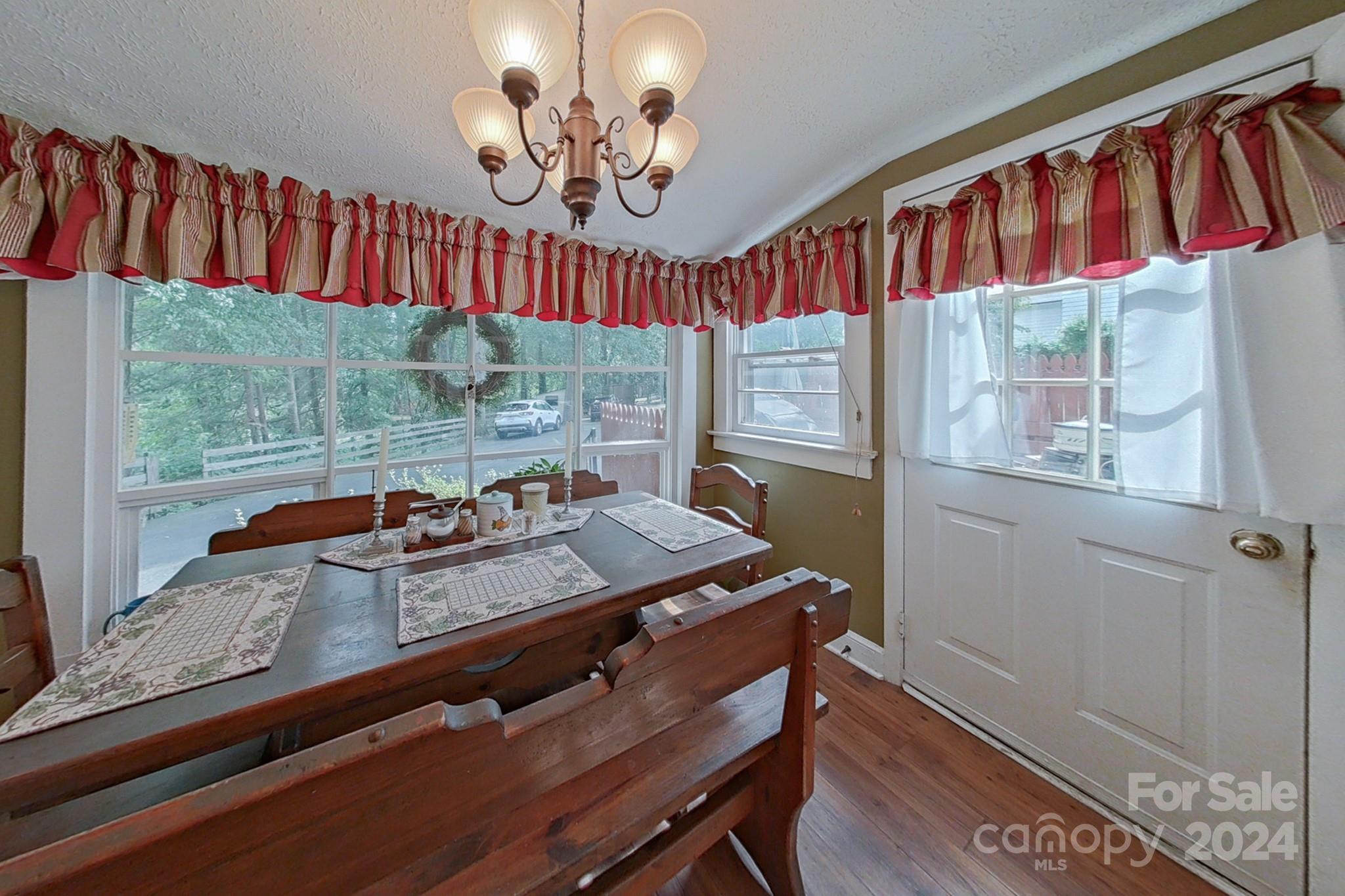 613 Dellinger Road Shelby, NC 28152 - Photo 7 of 19 a room with furniture a window and a chandelier