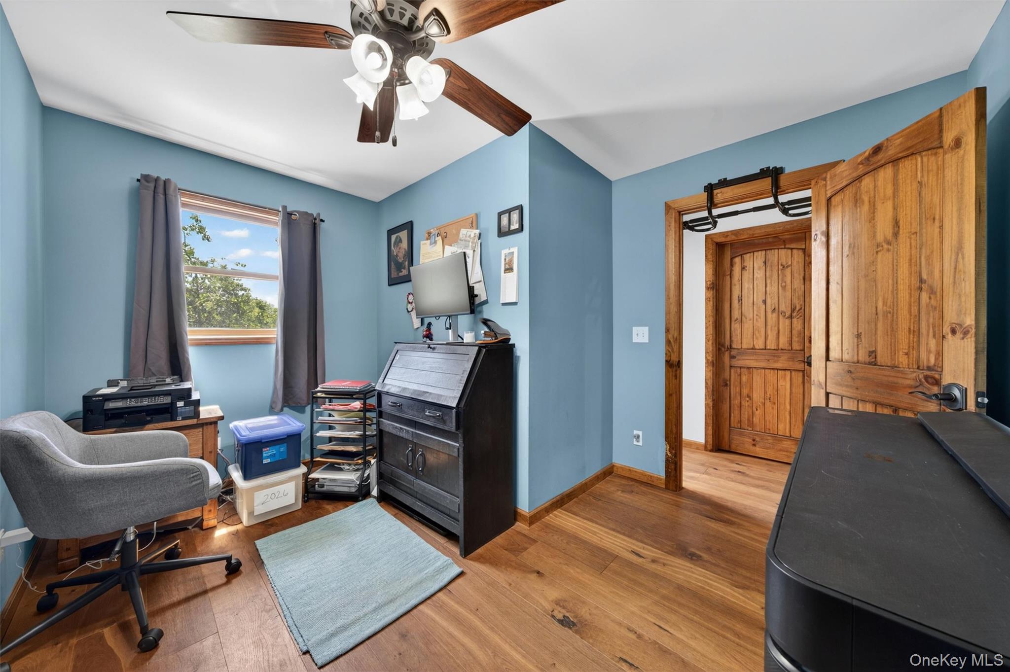 2 White Horse Road Middletown, NY 10940 - Photo 27 of 47 Within the expansive multi-room primary suite, a dedicated home office leads seamlessly into a finished recreation room, offering exceptional flexibility and privacy.