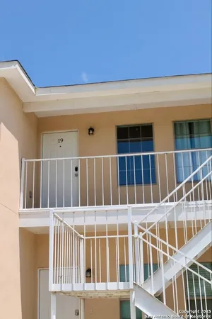 a view of balcony with wooden floor