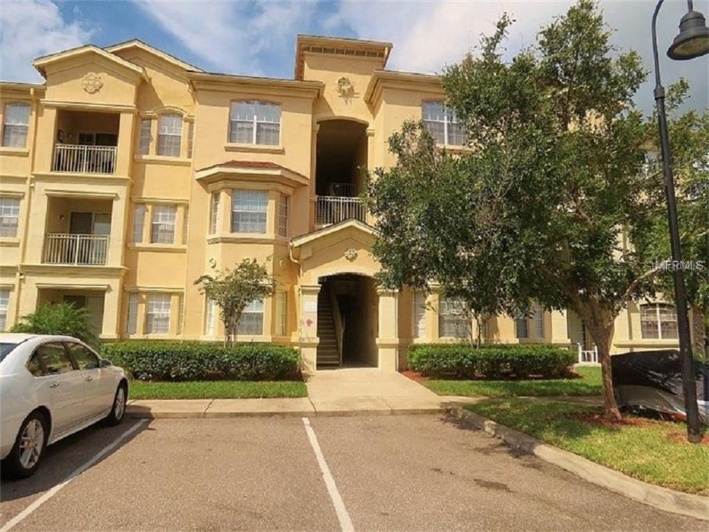 602 Terrace Ridge Circle, Unit 602 Davenport, FL 33896 - Photo 1 of 1 a front view of a house with a garden