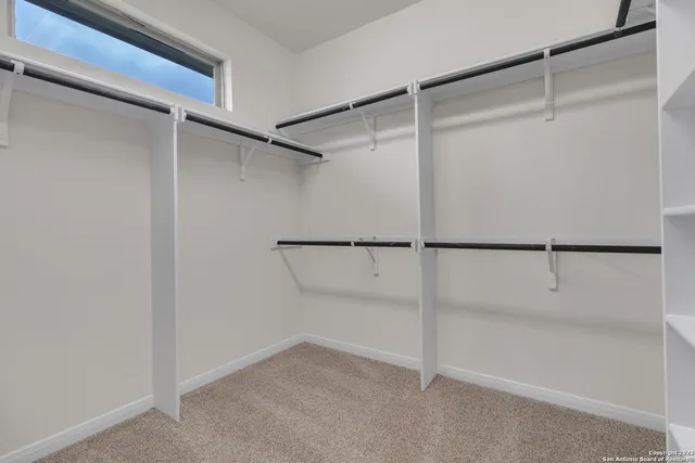 a view of an empty walk in closet