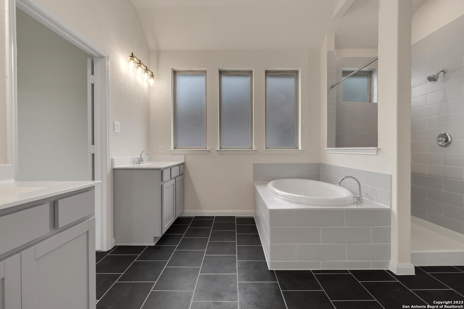 104 Matador Boerne, TX 78006 - Photo 19 of 33 a bathroom with a sink and a mirror