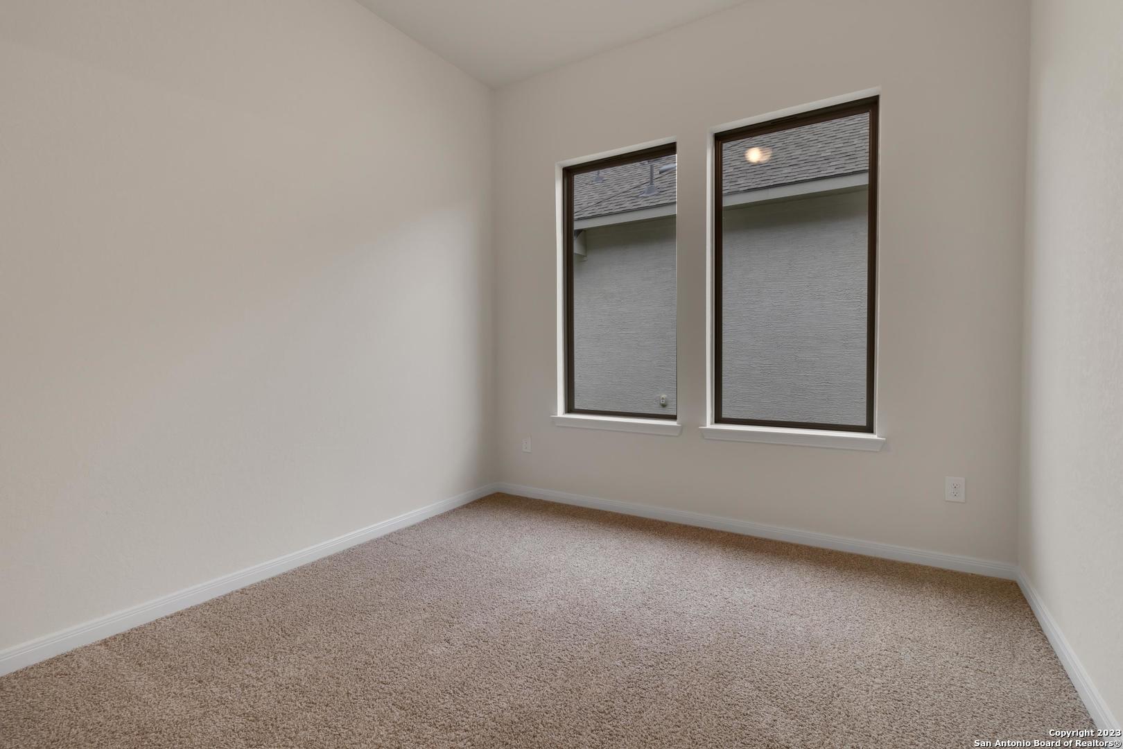 104 Matador Boerne, TX 78006 - Photo 21 of 33 an empty room with windows and closet
