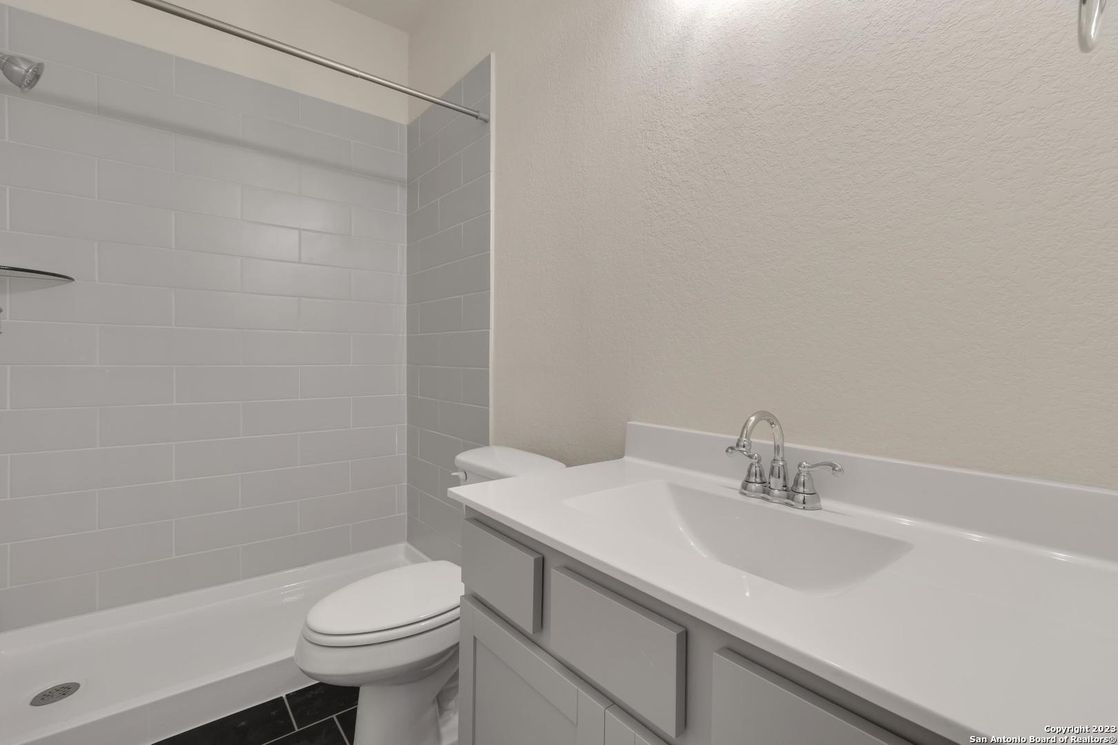 104 Matador Boerne, TX 78006 - Photo 23 of 33 a bathroom with a sink toilet and shower