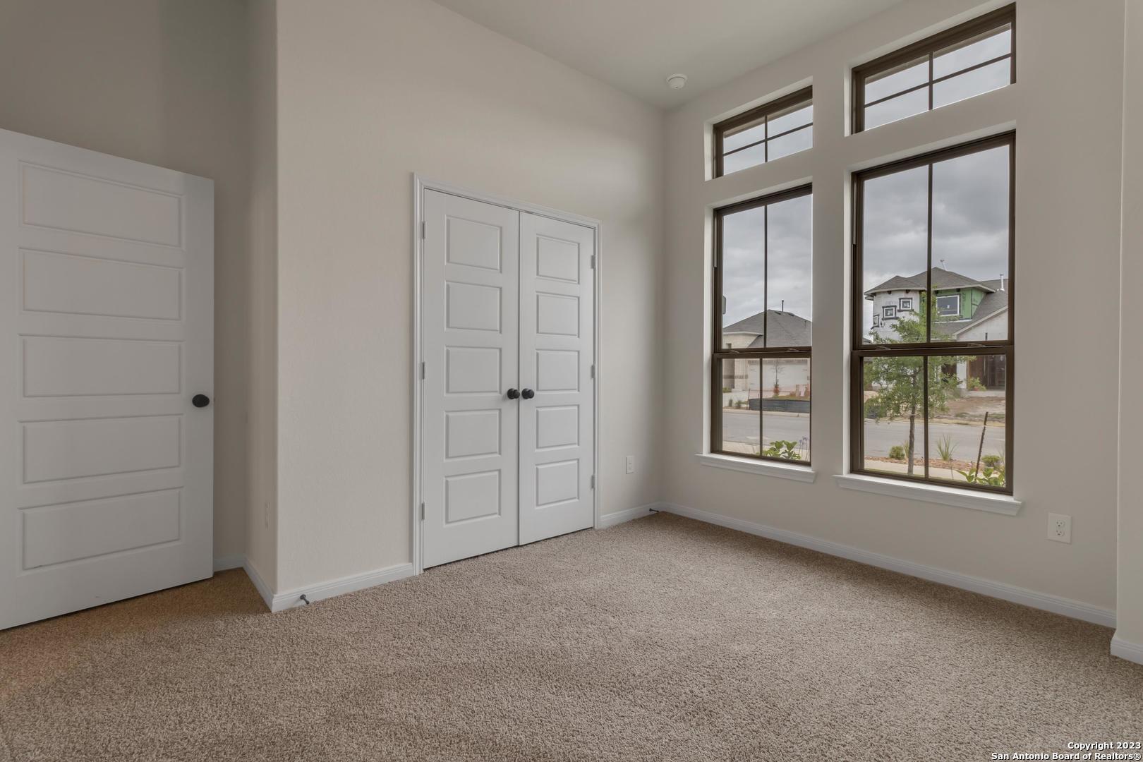 104 Matador Boerne, TX 78006 - Photo 28 of 33 an empty room with windows and closet