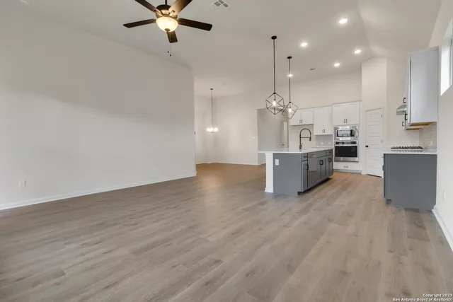 a view of kitchen with sink and wooden floor