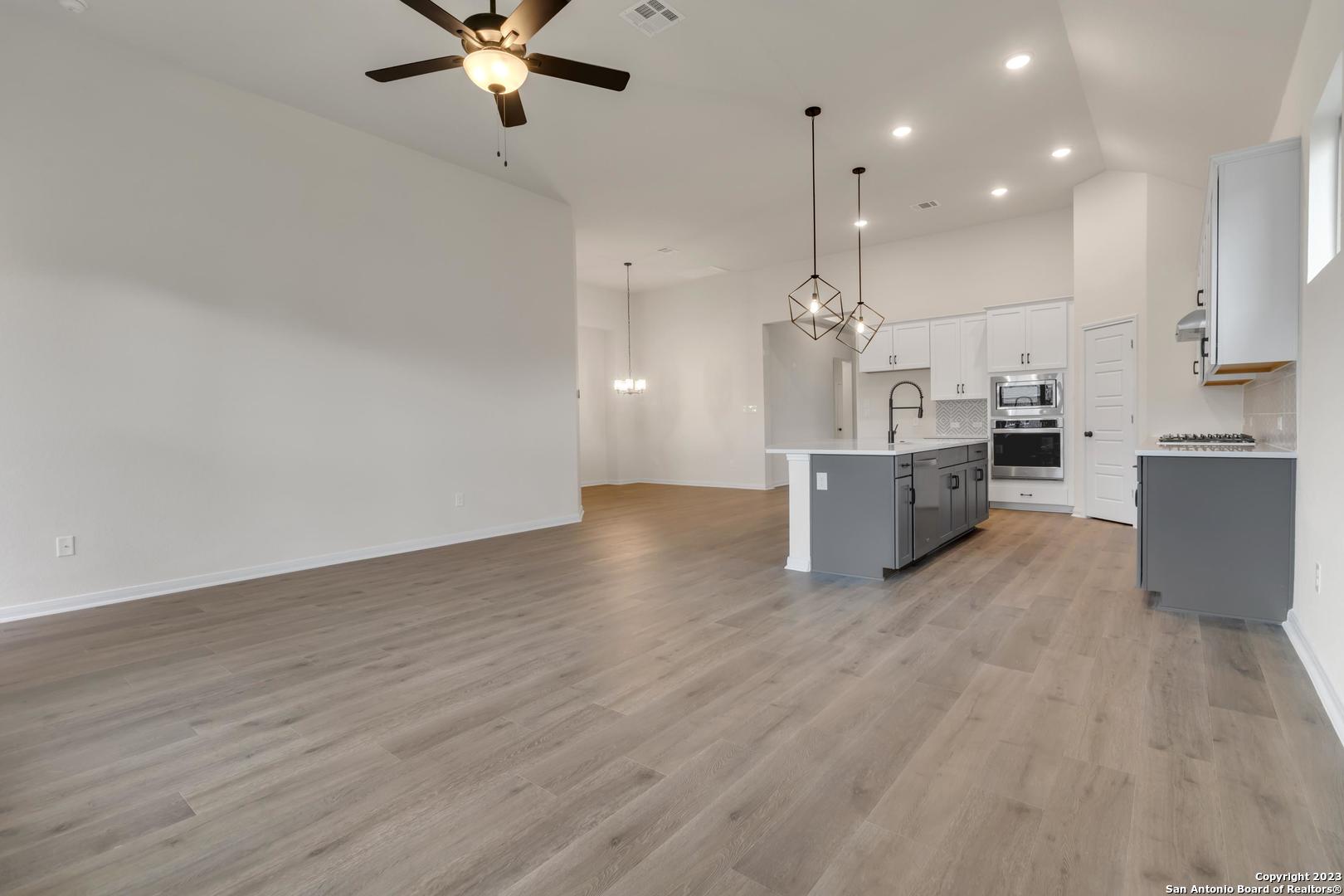 104 Matador Boerne, TX 78006 - Photo 6 of 33 a view of kitchen with sink and wooden floor