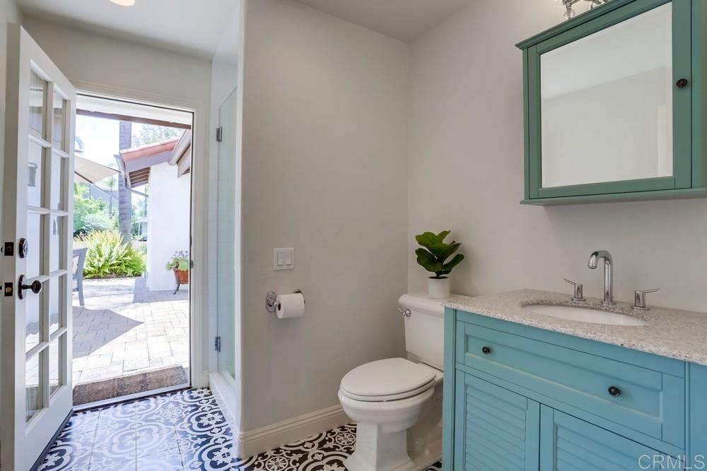 1283 Rancho Encinitas Drive Encinitas, CA 92024 - Photo 18 of 27 a bathroom with a sink toilet and shower