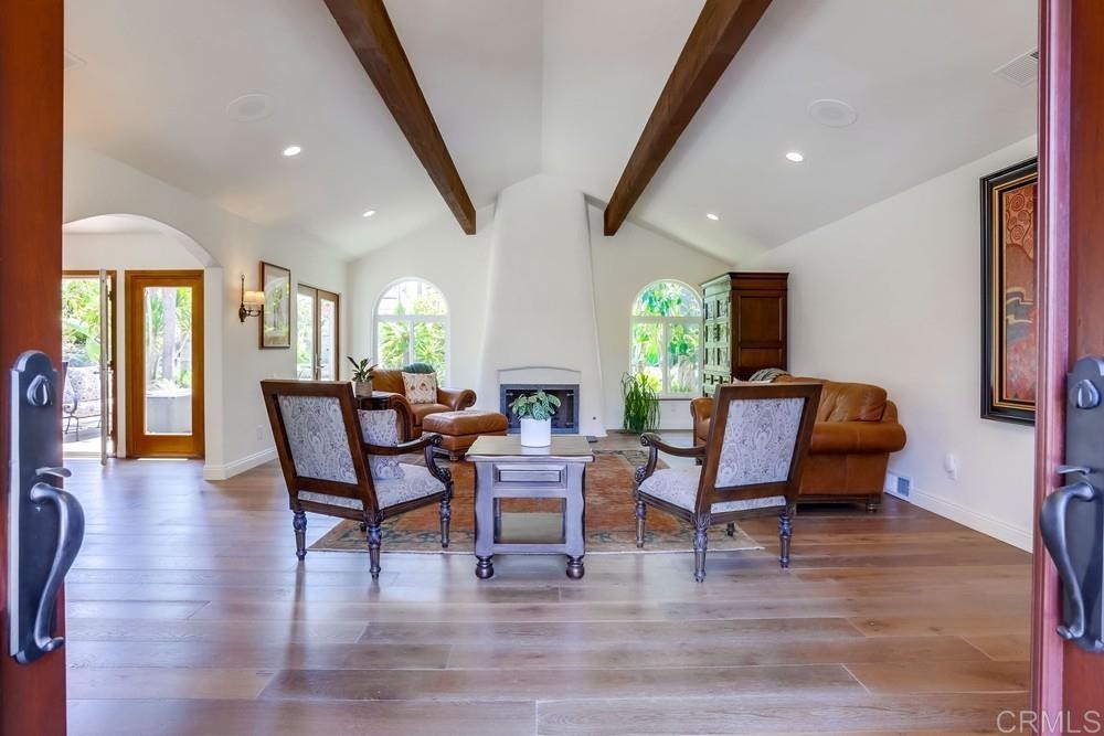 1283 Rancho Encinitas Drive Encinitas, CA 92024 - Photo 6 of 27 a living room with furniture and wooden floor